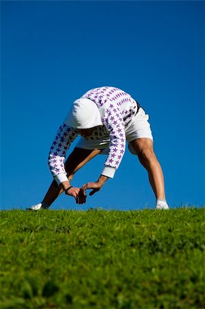 simsearch:400-04450996,k - healthy lifestyle: man doing stretching in a park Stock Photo - Budget Royalty-Free & Subscription, Code: 400-04958337