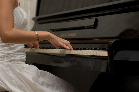 piano practice - a closeup of a girl ready to play the piano Stock Photo - Budget Royalty-Free & Subscription, Code: 400-04958460