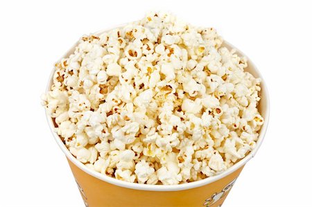 simsearch:400-04913050,k - Detail of popcorn in a bucket over a white background Photographie de stock - Aubaine LD & Abonnement, Code: 400-04958604