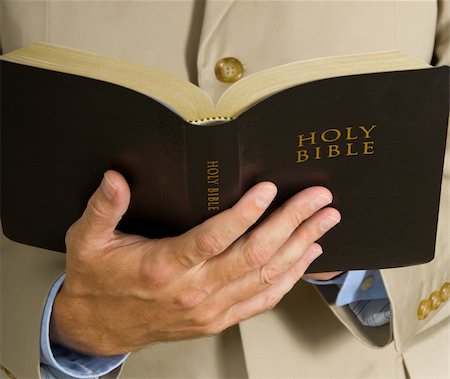 Man in business suit or preacher holding the BIble Stock Photo - Budget Royalty-Free & Subscription, Code: 400-04958666