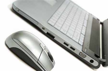 Laptop computer and mouse on white background Stock Photo - Budget Royalty-Free & Subscription, Code: 400-04958682