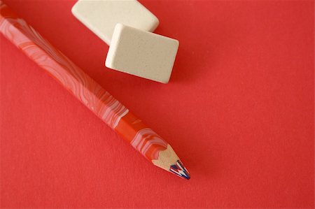 fedotishe (artist) - Pencil and two erasers on a red background Foto de stock - Super Valor sin royalties y Suscripción, Código: 400-04958823