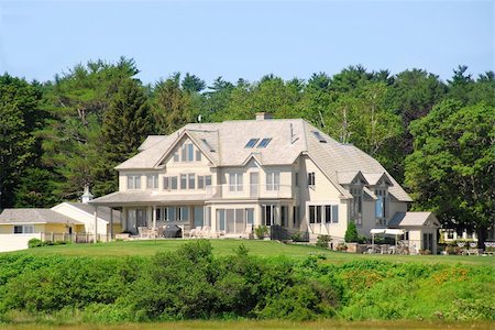 family holiday cottage - Large executive home surrounded by green trees Stock Photo - Budget Royalty-Free & Subscription, Code: 400-04959047