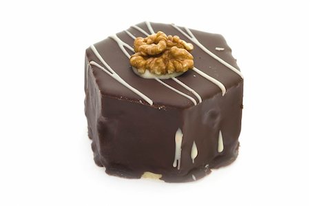 Delicious chocolate cake with walnut isolated on white background. Photographie de stock - Aubaine LD & Abonnement, Code: 400-04959406