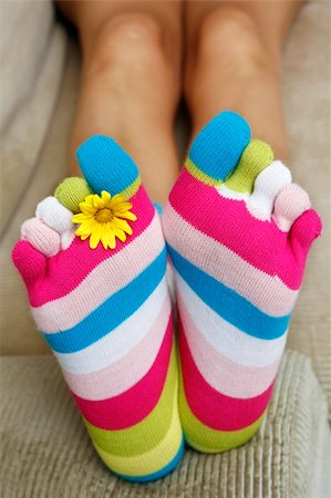 foot daisy - Bright socks and a daisy on the sofa Stock Photo - Budget Royalty-Free & Subscription, Code: 400-04950058