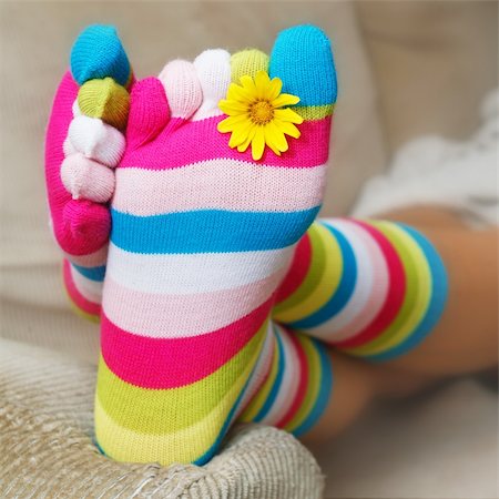 foot daisy - Bright socks and a daisy on the sofa Stock Photo - Budget Royalty-Free & Subscription, Code: 400-04950123