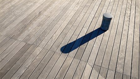 post modern architecture - small post and it's long shadow on the wooden deck background Stock Photo - Budget Royalty-Free & Subscription, Code: 400-04950648