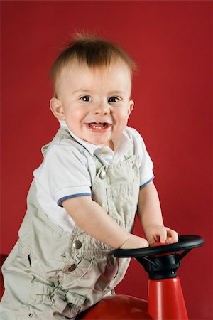 Portrait of Caucasian male child driving play car. Stock Photo - Budget Royalty-Free & Subscription, Code: 400-04951046