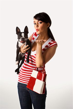 simsearch:400-04446187,k - Young adult female Caucasian holding Boston Terrier. Photographie de stock - Aubaine LD & Abonnement, Code: 400-04951178