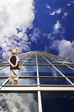 futuristic boy kid - Child and his path to future. Perspective of skyscraper windows Stock Photo - Budget Royalty-Free & Subscription, Code: 400-04952106