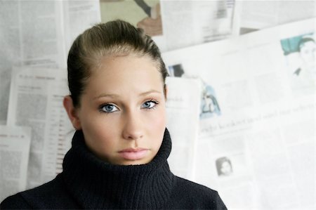 a beauty portrait of young businesswoman against a wall with a lot of newspapers Stock Photo - Budget Royalty-Free & Subscription, Code: 400-04952197