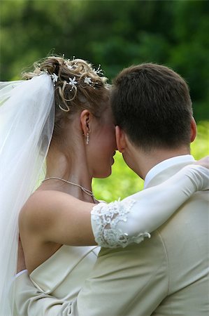 simsearch:400-04440941,k - The bride with a smile, gently embraces the groom Fotografie stock - Microstock e Abbonamento, Codice: 400-04952445