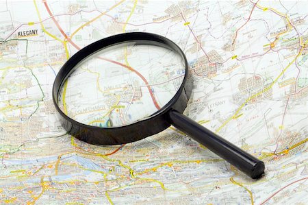 magnifying glass on a map - close-up Stock Photo - Budget Royalty-Free & Subscription, Code: 400-04952589