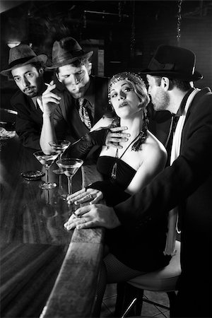 flapper - Caucasian prime adult retro female sitting at bar surrounded by suitors. Stock Photo - Budget Royalty-Free & Subscription, Code: 400-04952651