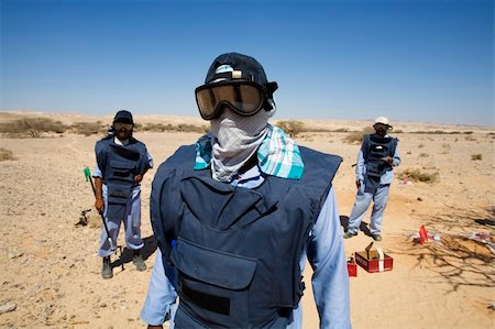 dead people in deserts - deminer in action cleaning the area from mines Stock Photo - Budget Royalty-Free & Subscription, Code: 400-04952849
