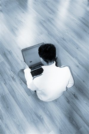 simsearch:400-04651437,k - a young business man is holding a notebook in his hands in front of a shiny background Stockbilder - Microstock & Abonnement, Bildnummer: 400-04952917