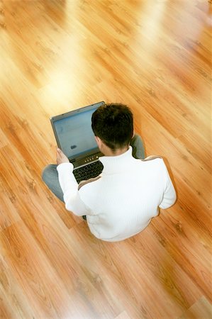 simsearch:400-04651437,k - a young business man is holding a notebook in his hands in front of a shiny background Stockbilder - Microstock & Abonnement, Bildnummer: 400-04952918