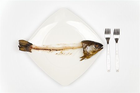 fish bones on plate - eaten fish with head and tail - symbol of misery Stock Photo - Budget Royalty-Free & Subscription, Code: 400-04953174