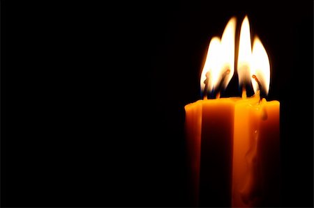Four Candles isolated over dark background. Stock Photo - Budget Royalty-Free & Subscription, Code: 400-04953474