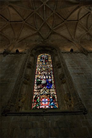 Stained glass window inside Mosteiro dos Jeronimos in Lisbon, Portugal. Foto de stock - Royalty-Free Super Valor e Assinatura, Número: 400-04953869