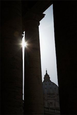 Sun peeking through doric columns in Saint Peter's Square in Vatican City, Italy. Stock Photo - Budget Royalty-Free & Subscription, Code: 400-04953975