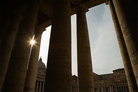 Sun peeking through doric columns in Saint Peter's Square in Vatican City, Italy. Stock Photo - Budget Royalty-Free & Subscription, Code: 400-04953976