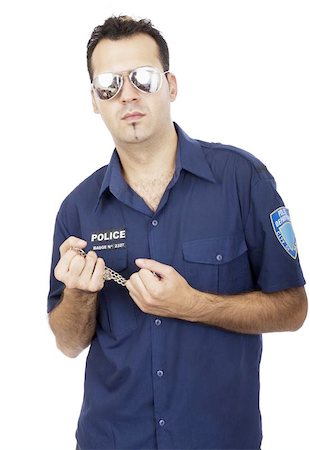 simsearch:400-04670594,k - Cool policeman holding a chain Foto de stock - Super Valor sin royalties y Suscripción, Código: 400-04964524