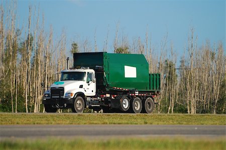 Green industrial garbage truck Stock Photo - Budget Royalty-Free & Subscription, Code: 400-04964694