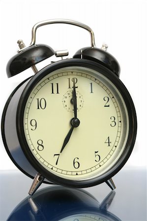 The black alarm clock is isolated on a white background Stockbilder - Microstock & Abonnement, Bildnummer: 400-04965021