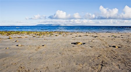 simsearch:400-07321921,k - Galway Bay in Ireland. The photo is layered with sand, water, The Burren (hills), and sky. Stock Photo - Budget Royalty-Free & Subscription, Code: 400-04965327