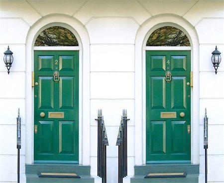 Symmetric photo of two front doors in typical London street Stock Photo - Budget Royalty-Free & Subscription, Code: 400-04965733