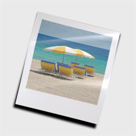 simsearch:400-07625542,k - Beach lounge chairs under yellow umbrellas Foto de stock - Super Valor sin royalties y Suscripción, Código: 400-04965885