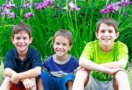 simsearch:400-04449607,k - Group of Boys in Front of Purple Flowers Photographie de stock - Aubaine LD & Abonnement, Code: 400-04966574