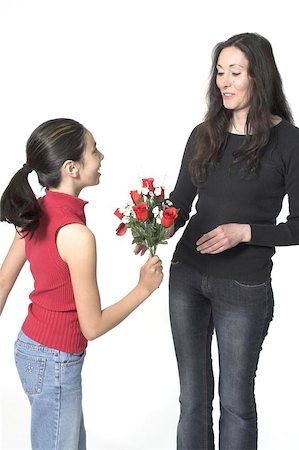 daughter offering flowers to her mother Photographie de stock - Aubaine LD & Abonnement, Code: 400-04967372