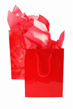 Two red shopping bags isolated on white background Foto de stock - Super Valor sin royalties y Suscripción, Código: 400-04967473