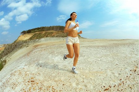 feet marathon - woman running on sand Stock Photo - Budget Royalty-Free & Subscription, Code: 400-04967614