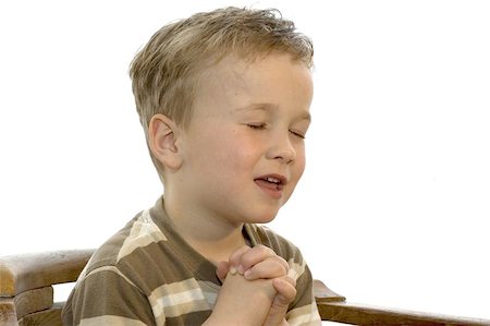 disciple - Five year old boy praying and singing Photographie de stock - Aubaine LD & Abonnement, Code: 400-04968078