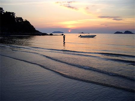 sunset lonely men - A man with his cellular phone on the beach at Koh Chang, Thailand. Stock Photo - Budget Royalty-Free & Subscription, Code: 400-04968598