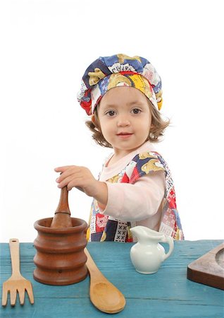 Cute toddler cooking dressed as a chef. More pictures of this baby at my gallery Stock Photo - Budget Royalty-Free & Subscription, Code: 400-04969011