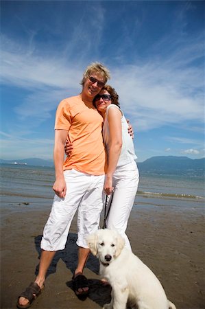 young couple on the beach with dog in vancouver Stock Photo - Budget Royalty-Free & Subscription, Code: 400-04960665