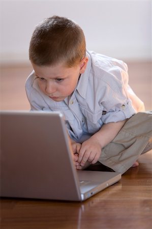 fabthi (artist) - Child impatient waiting to learn with a computer at home Stock Photo - Budget Royalty-Free & Subscription, Code: 400-04960897