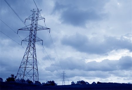 simsearch:400-04838002,k - The silhouette of a power lines and towers against blue sky. Foto de stock - Royalty-Free Super Valor e Assinatura, Número: 400-04960952