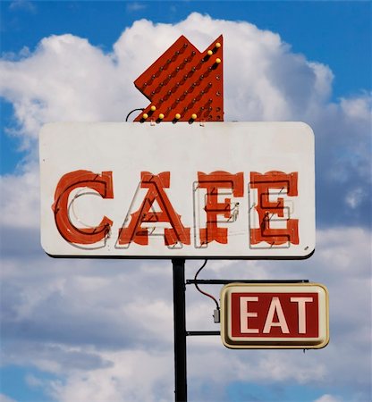 dinner in the sky - Old cafe sign with the word "eat" against a cloudy sky. Foto de stock - Super Valor sin royalties y Suscripción, Código: 400-04961709