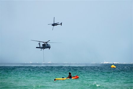 disaster and rescue - helicopters rescuing stranded boaters Foto de stock - Super Valor sin royalties y Suscripción, Código: 400-04963922