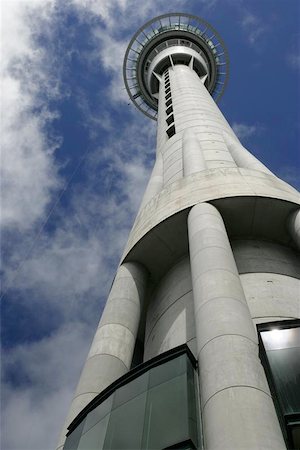 A worm's eye view of the Skytower in Auckland, New Zealand.  On the left of the platform, a jumper is falling from the jumping platform. Stock Photo - Budget Royalty-Free & Subscription, Code: 400-04974389