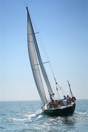 sailboat racing - The large, beautiful yacht in the light-blue sea. A fresh wind and pleasant movement Stock Photo - Budget Royalty-Free & Subscription, Code: 400-04974449