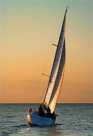 simsearch:400-05004133,k - The Gold sails. The gold sky. The winner. Beautiful idyllic picture. Stockbilder - Microstock & Abonnement, Bildnummer: 400-04974451