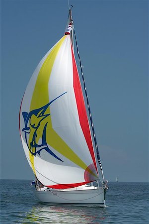 spinnaker - beautiful sail. the dark blue sea. rest and romanticism Photographie de stock - Aubaine LD & Abonnement, Code: 400-04974453