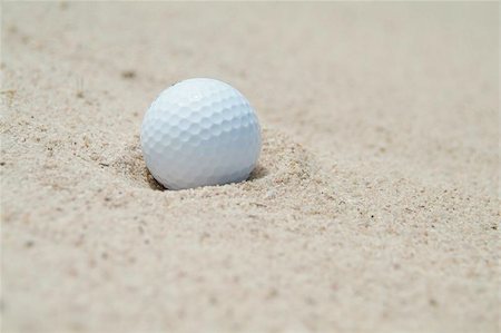 Golf-ball in bunker. Shallow depth of field. Stock Photo - Budget Royalty-Free & Subscription, Code: 400-04975198