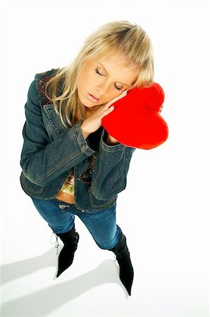 Blonde sexy girl holding a red velvet heart Stock Photo - Budget Royalty-Free & Subscription, Code: 400-04975294